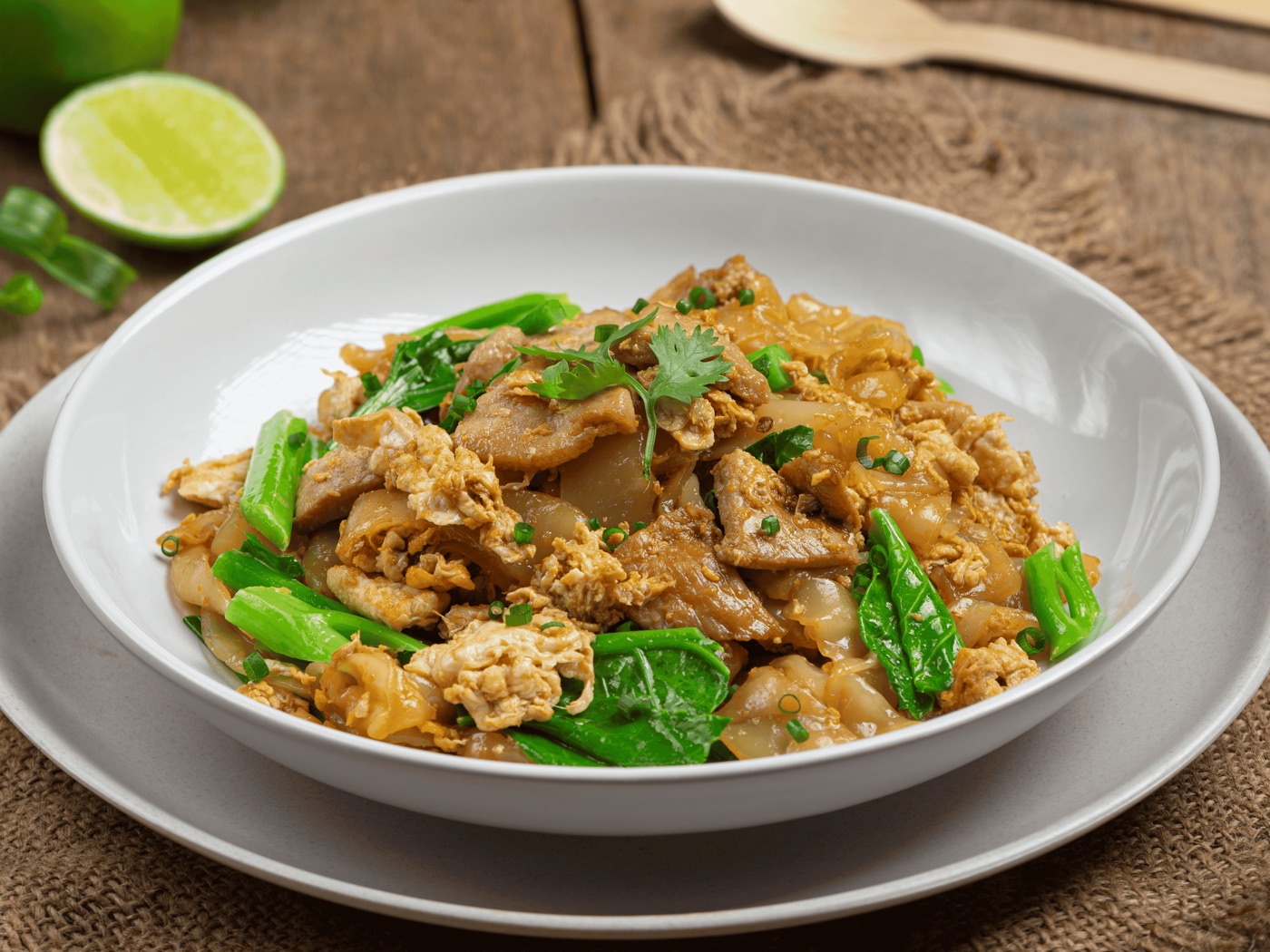 Pad See Ew with pork, egg, Chinese broccoli, and wide rice noodles