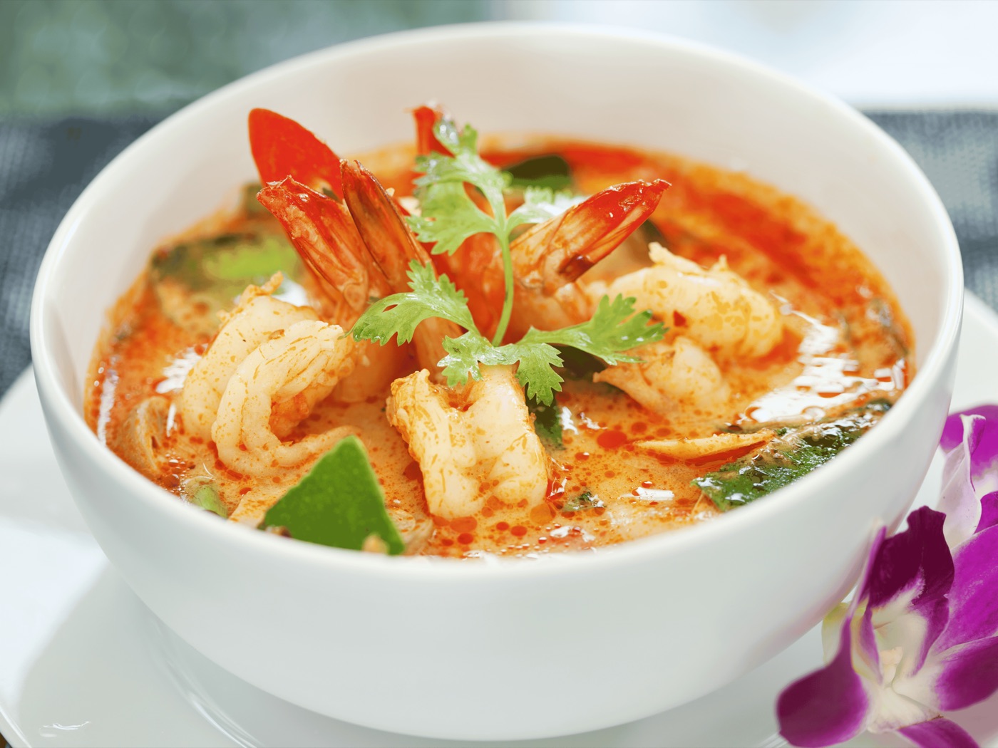 Tom Yum shrimp soup with lemongrass, lime leaves, chili, and cilantro